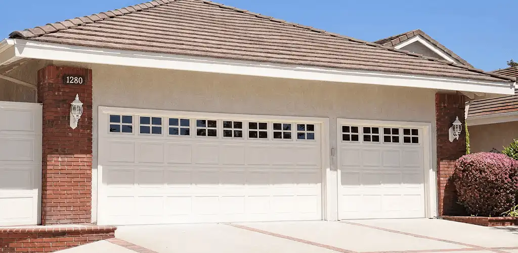 Residential garage door repair service for a double garage door in Overland Park, KS