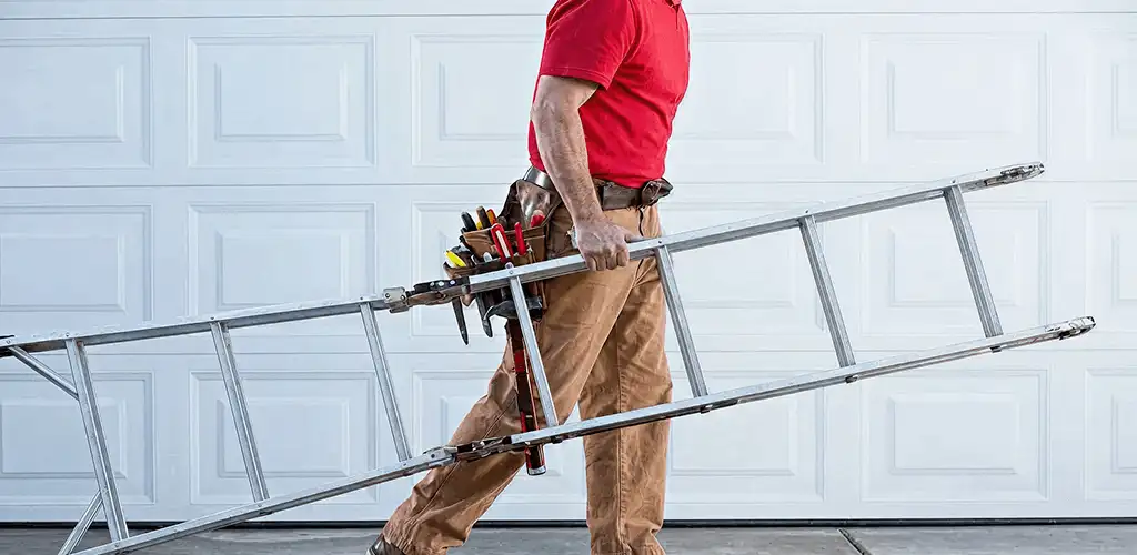 Garage door repair technician arriving with tools and ladder in Overland Park, KS