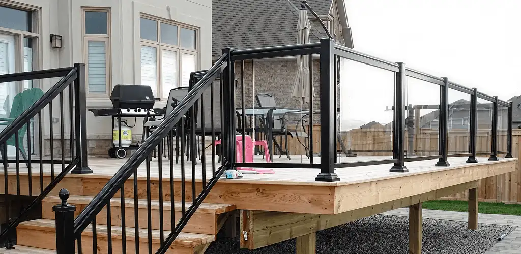 Handrail installation on a deck staircase for safety and code compliance in Overland Park, KS